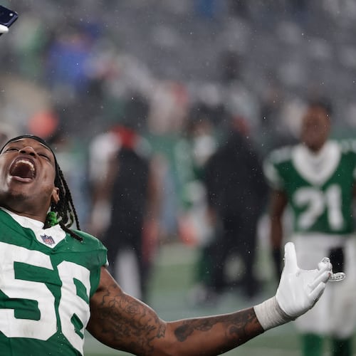 New York Jets linebacker Quincy Williams (56) celebrates victory over the Atlanta Falcons after an NFL football game, Sunday, Nov. 30, 2025, in East Rutherford, N.J. (AP Photo/Adam Hunger)