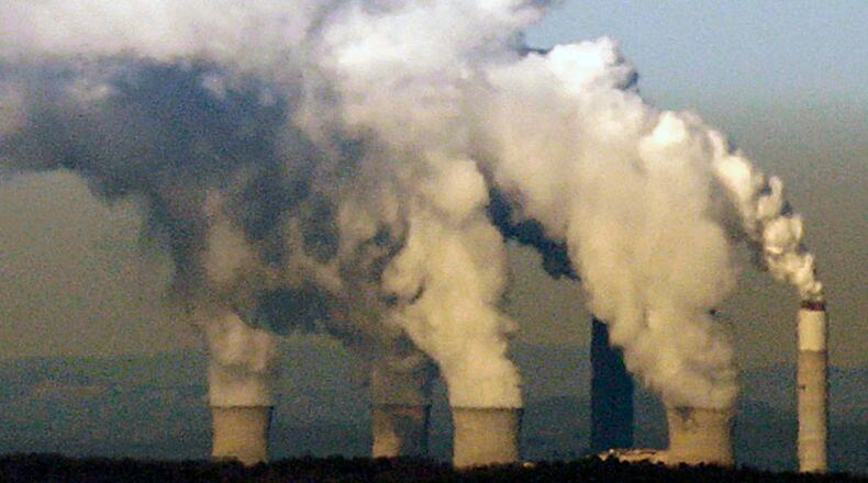 Water vapor from Georgia Power's Plant Bowen's cooling towers and scrubber stacks near Euharlee as seen from the top of Kennesaw Mountain, about 30 miles away. AJC File