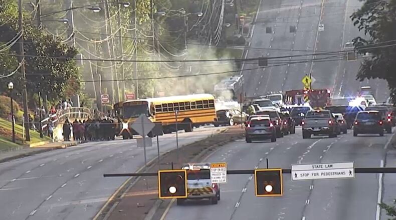 The crash happened shortly after 8 a.m. in the 3500 block of Buford Highway. There were about 40 middle school students on the bus at the time.