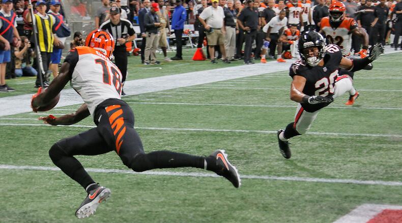 9/30/18 - Atlanta -  Atlanta Falcons cornerback Isaiah Oliver (20) gets beat by Cincinnati Bengals wide receiver A.J. Green (18) as Green got open in the end zone to score the winning touchdown for the Bengals.  The Atlanta Falcons played the Cincinnati Bengals in an NFL football game Sunday, Sept 29, 2018, at Mercedes-Benz Stadium in Atlanta, GA.  BOB ANDRES  / BANDRES@AJC.COM