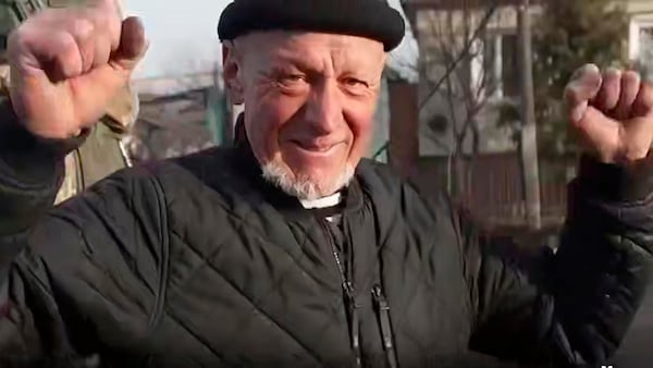 FILE - In this image made from a video distributed by the Russian Defense Ministry Press Service on Friday, March 14, 2025, a resident of Sudzha, the biggest town in the Kursk region of Russia seized by Ukrainian troops, reacts to seeing Russian soldiers who retook the town. (Russian Defense Ministry Press Service via AP, File)