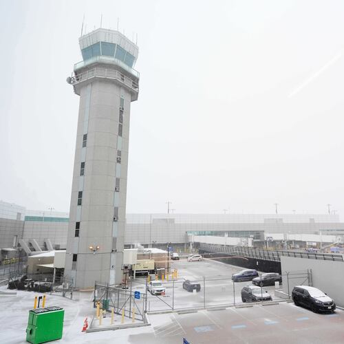 The control tower at Love Field Airport is shown where weather conditions have had an impact on travel in and out of the normally busy airport Saturday, Jan. 24, 2026, in Dallas. (AP Photo/Tony Gutierrez)