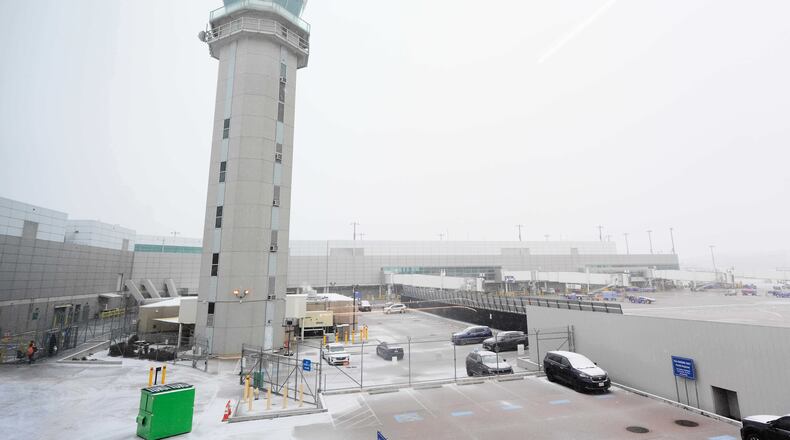 The control tower at Love Field Airport is shown where weather conditions have had an impact on travel in and out of the normally busy airport Saturday, Jan. 24, 2026, in Dallas. (AP Photo/Tony Gutierrez)