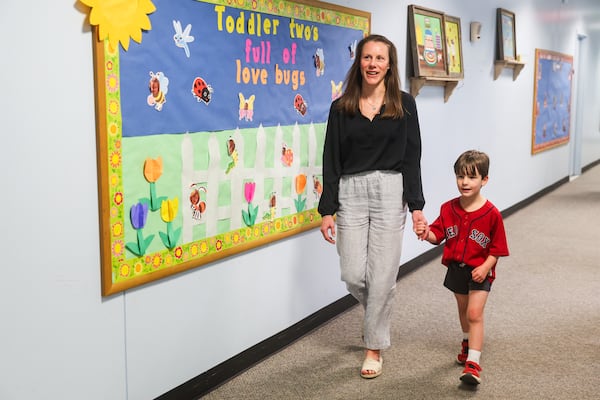 Rebecca Ellis walks her son, John Patrick, back to class at the Capitol Hill Child Enrichment Center in Atlanta on Wednesday, April 22, 2026. (Abbey Cutrer/AJC)