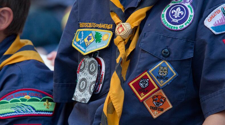 In this June 25, 2016, file photo, Cub Scouts watch a race during the Second Annual World Championship Pinewood Derby in New York's Times Square.