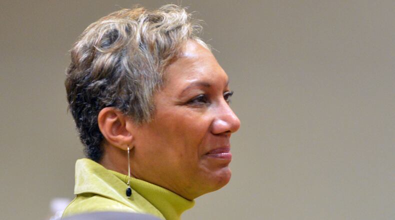 Pat Reid listens as her defense attorney, Tony Axam, presents his closing arguments Friday afternoon Nov. 15, 2013.