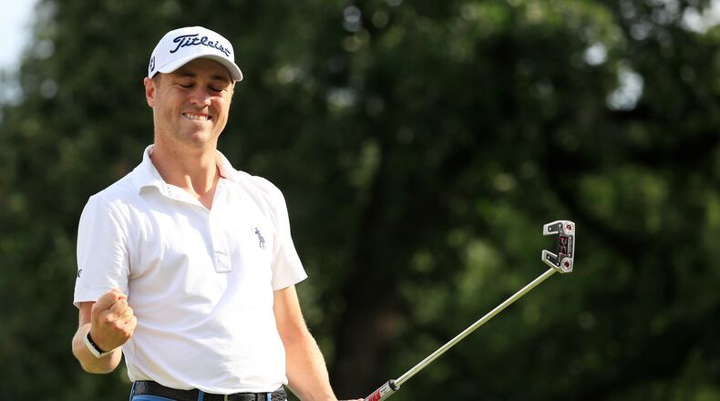 Justin Thomas celebrates the closing out of his victory at the BMW Championship at Medinah. (Photo by Cliff Hawkins/Getty Images)