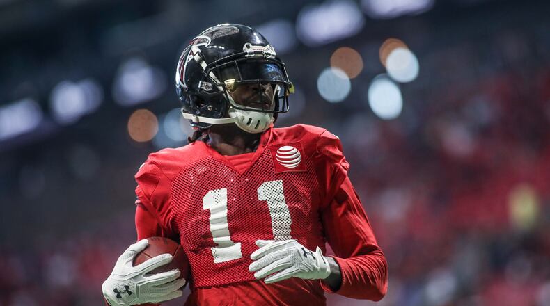Atlanta Falcons wide receiver Julio Jones (11) after catching a ball during open practice Sunday, July 29, 2018, at Mercedes-Benz Stadium in Atlanta.