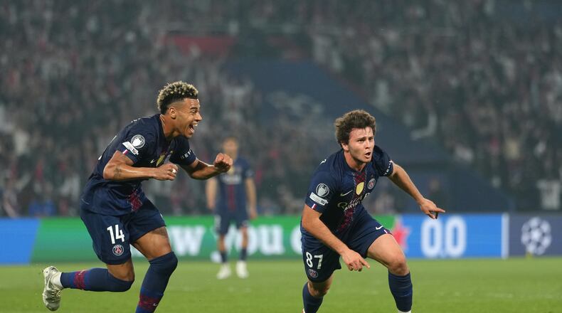 PSG's Joao Neves, right, celebrates after scoring his side's second goal during a Champions League semifinal, first leg, soccer match between Paris Saint-Germain and Bayern Munich in Paris, Tuesday, April 28, 2026. (AP Photo/Aurelien Morissard)