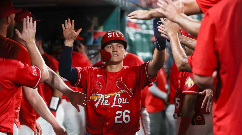 St. Louis Cardinals' JJ Wetherholt is congratulated by teammates after scoring a run during the sixth inning of a baseball game against the Atlanta Braves Friday, July 10, 2026, in St. Louis. (AP Photo/Scott Kane)