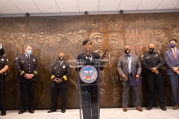 Atlanta Mayor Keisha Lance Bottoms leads a press conference on Aug. 3, 2021, at City Hall to address rising crime, a murder in Piedmont Park, and COVID-19 delta variant concerns. Behind the mayor to her immediate left is Atlanta Police Chief Rodney Bryant. (Jenni Girtman for The Atlanta Journal-Constitution)
