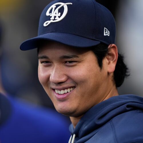 Los Angeles Dodgers' Shohei Ohtani smiles in the dugout during the first inning of a baseball game against the Washington Nationals, Saturday, Sept. 5, 2026, in Los Angeles. (AP Photo/Mark J. Terrill)