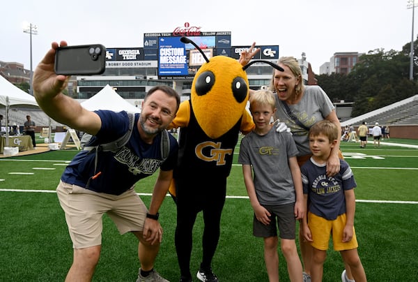 Jay Wozniak (left) and his family got friendly with mascot Buzz at Georgia Tech's recent "First Saturday on the Flats" event.