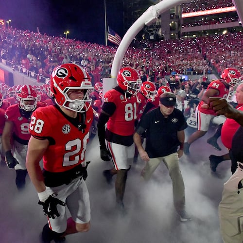 Georgia head coach Kirby Smart and players run onto the field before an NCAA football game against Texas at Sanford Stadium, Saturday, Nov. 15, 2025, in Athens. Georgia won 35-10 over Texas. (Hyosub Shin/AJC)