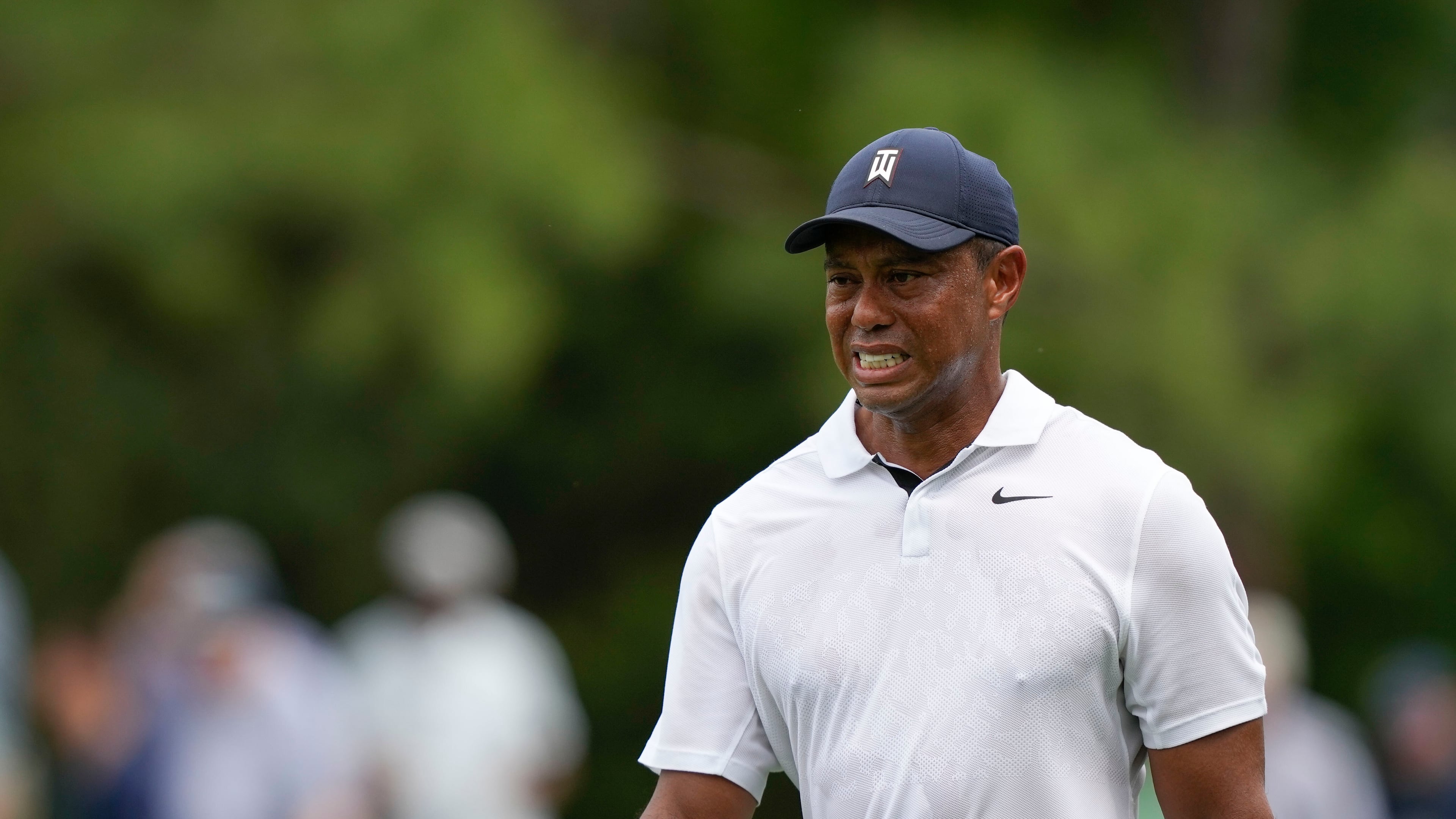 FILE - Tiger Woods grimaces on the 15th hole during the first round of the Masters golf tournament at Augusta National Golf Club on Thursday, April 6, 2023, in Augusta, Ga. (AP Photo/David J. Phillip, File)
