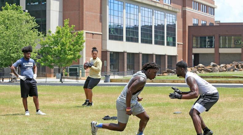 (Left to right) Randy Britt, Kaece Supples, Keeman Hayes and Travis Davis run one-on-ones during an unsanctioned player-led football practice on Thursday, June 4, 2020, at Tucker High School in Tucker, Georgia. The players planned the off-season practice despite uncertainty surrounding the upcoming football season amid coronavirus concerns. CHRISTINA MATACOTTA FOR THE ATLANTA JOURNAL-CONSTITUTION