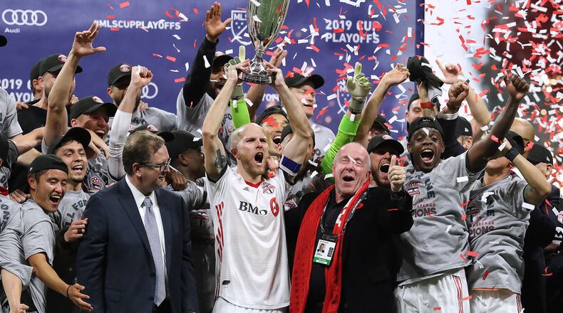 Toronto FC celebrates defeating Atlanta United 2-1 to hoist the trophy in the Eastern Conference Final on Wednesday, October 30, 2019, in Atlanta.   Curtis Compton/ccompton@ajc.com