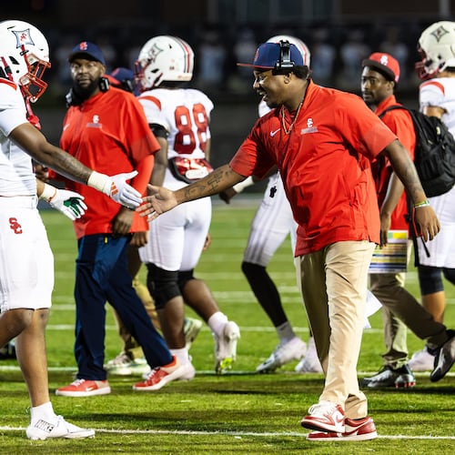 The Sandy Creek football team celebrates their victory over Douglas County at Douglas County High School in Douglasville, GA on Friday, August 28, 2026. (Oscar Guevara Saenz for the AJC)