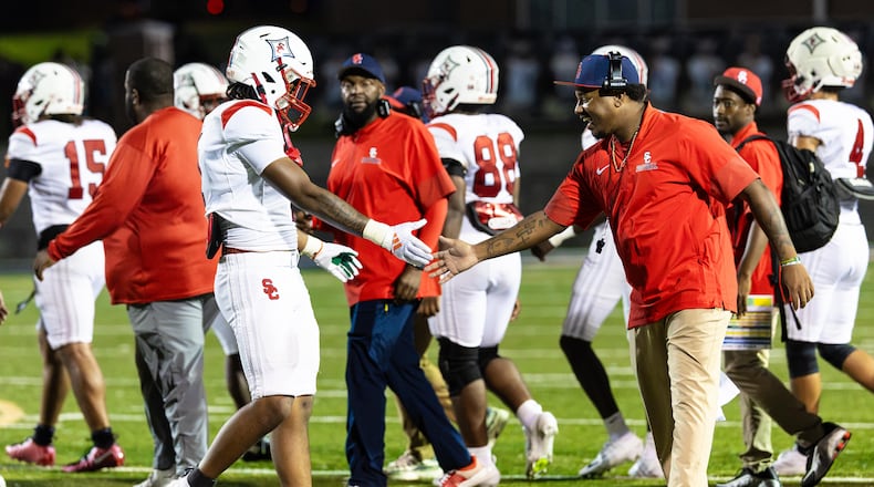 The Sandy Creek football team celebrates their victory over Douglas County at Douglas County High School in Douglasville, GA on Friday, August 28, 2026. (Oscar Guevara Saenz for the AJC)