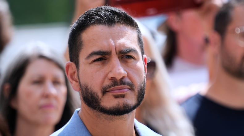 Democratic nominee for U.S. Senate Abdul El-Sayed listens during a news conference at the Spirit of Detroit monument Wednesday, Aug. 19, 2026, in Detroit. (AP Photo/Paul Sancya)