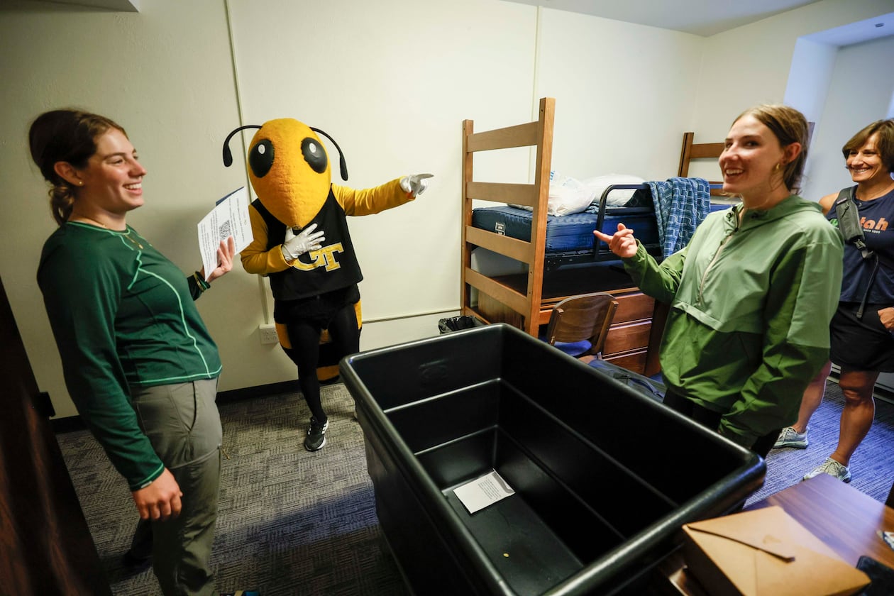 Georgia Tech mascot Yellow Jacket Buzz teases Civil and Environmental student Sofia Jouraron and Mechanical Engineering student Olivia Cozette during move-in day at Georgia Tech on Sunday, Aug. 10, 2025. (Miguel Martinez/AJC)