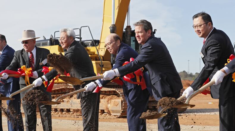 SK Innovation President and CEO Jun Kim, left, U.S. Secretary of Commerce Wilbur Ross, Gov. Brian Kemp, and Jaewon Chey, SK Group Executive Vice Chairman, joined in a 2019 groundbreaking ceremony for a new battery factory in Jackson County. Bob Andres / bandres@ajc.com
