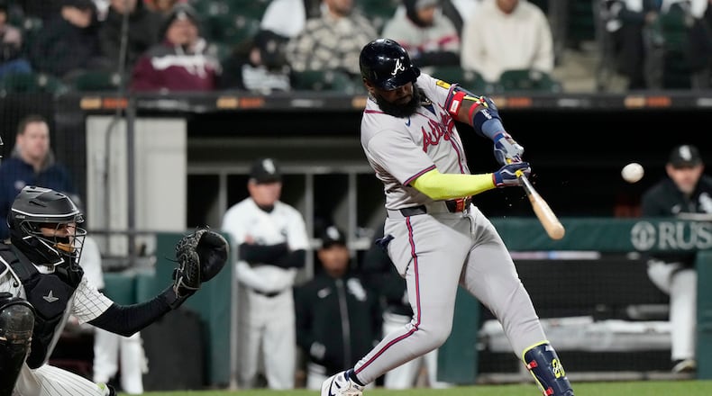 Atlanta Braves' Marcell Ozuna hits a solo home run during the ninth inning of a baseball game against the Chicago White Sox in Chicago, Tuesday, April 2, 2024. (AP Photo/Nam Y. Huh)