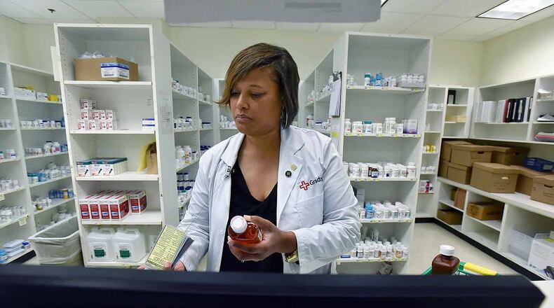 Pharmacist Bridget McCord prepares prescriptions at Grady Memorial Hospital. It provides prescriptions for $5 or less to thousands of outpatients who are low-income or do not have insurance.