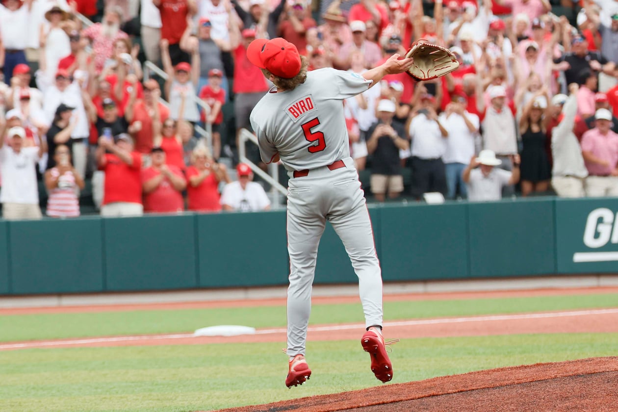 Georgia Bulldogs pitcher Justin Byrd tosses his glove to celebrate striking out the last Mississippi State batter during the 10th inning to secure the NCAA Super Regional victory Sunday, June 7, 2026. (Miguel Martinez/AJC)