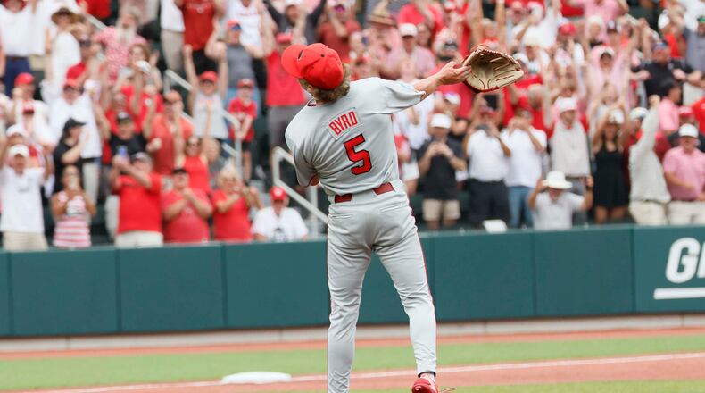 Georgia Bulldogs pitcher Justin Byrd tosses his glove to celebrate striking out the last Mississippi State batter during the 10th inning to secure the NCAA Super Regional victory Sunday, June 7, 2026. (Miguel Martinez/AJC)