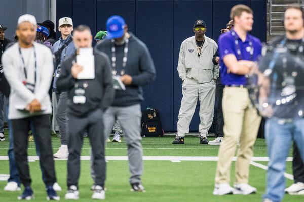 Colorado State head coach Deion Sanders watches drills from the background during the Big 12 Conference's NFL football pro day Thursday, March 20, 2025, in Frisco, Texas. (AP Photo/Jessica Tobias)