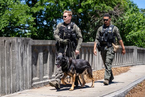 Atlanta Police K9 offciers search the scene of a stabbing on the Beltline near Montgomery Ferry Drive. Thursday, May 14, 2026 (Ben Hendren for the AJC)