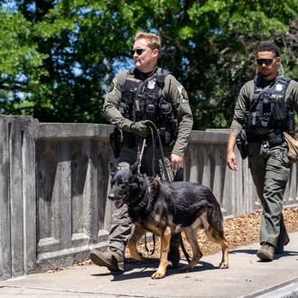 Atlanta Police K9 officers search the scene of a stabbing on the Beltline near Montgomery Ferry Drive, Thursday, May 14, 2026. (Ben Hendren for the AJC)