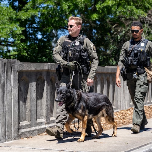 Atlanta Police K9 officers search the scene of a stabbing on the Beltline near Montgomery Ferry Drive, Thursday, May 14, 2026. (Ben Hendren for the AJC)