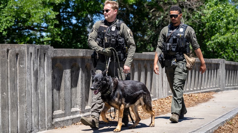 Atlanta Police K9 officers search the scene of a stabbing on the Beltline near Montgomery Ferry Drive, Thursday, May 14, 2026. (Ben Hendren for the AJC)