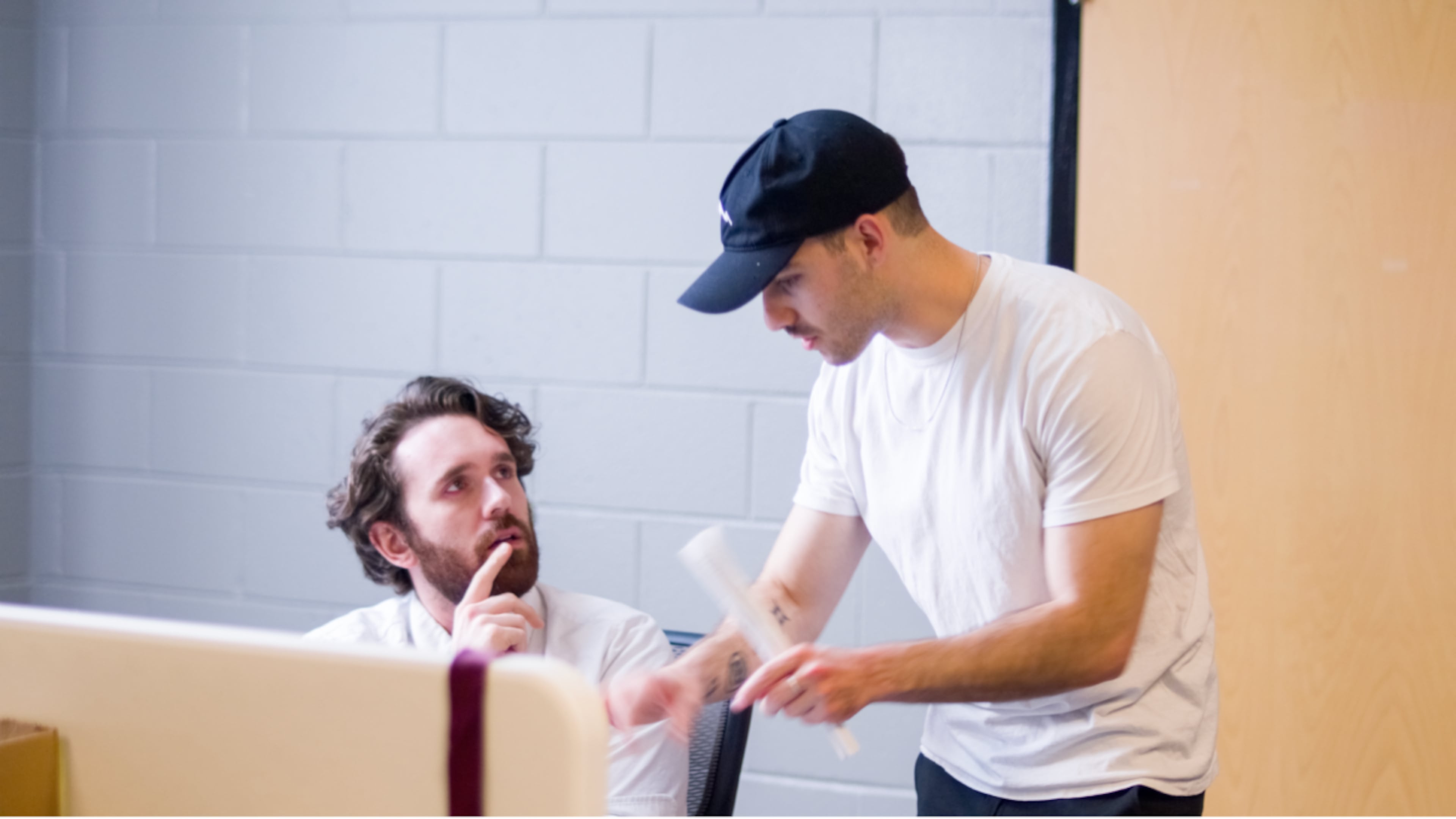 Two students converse at a workshop about narrative directing at Trilith Institute. (Courtesy of Trilith Institute)