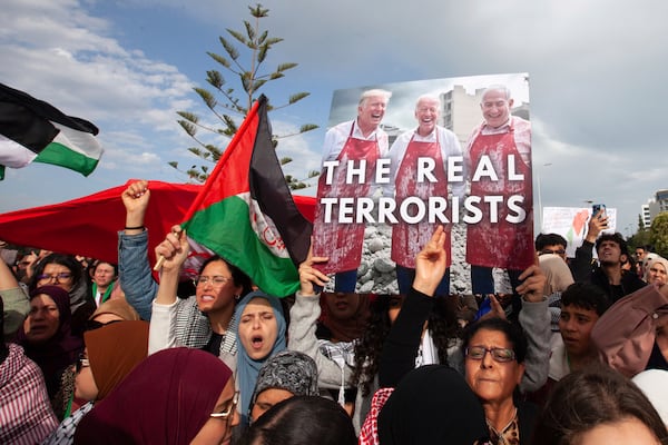 Protesters demonstrate outside the U.S. embassy to condemn military actions in Palestine, Yemen, and Syria, Saturday, April 5, 2025 in Tunis. (AP Photo/Ons Abid)