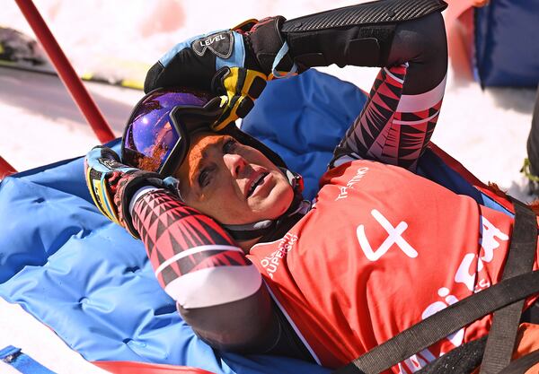 Italy's Federica Brignone is carried away on a toboga after she broke multiple bones in her left leg during a giant slalom crash at the Italian championships in the Lusia ski area, in Val di Fassa, Italy, Thursday, April 3, 2025. (AP Photo/Elvis Piazzi)