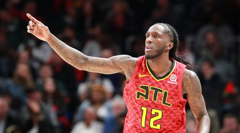Taurean Prince reacts after scoring against the Milwaukee Bucks. Curtis Compton/ccompton@ajc.com