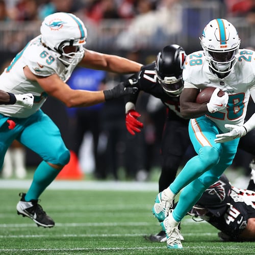 Miami Dolphins running back De'Von Achane (28) runs during the first half of an NFL football game against the Atlanta Falcons, Sunday, Oct. 26, 2025, in Atlanta. (AP Photo/Colin Hubbard)