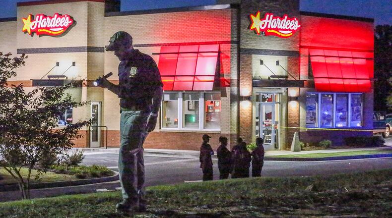 Fairburn police were investigating a shooting in the parking lot of the Hardee’s on Senoia Road on Friday, Sept. 18, 2015. JOHN SPINK / JSPINK@AJC.COM