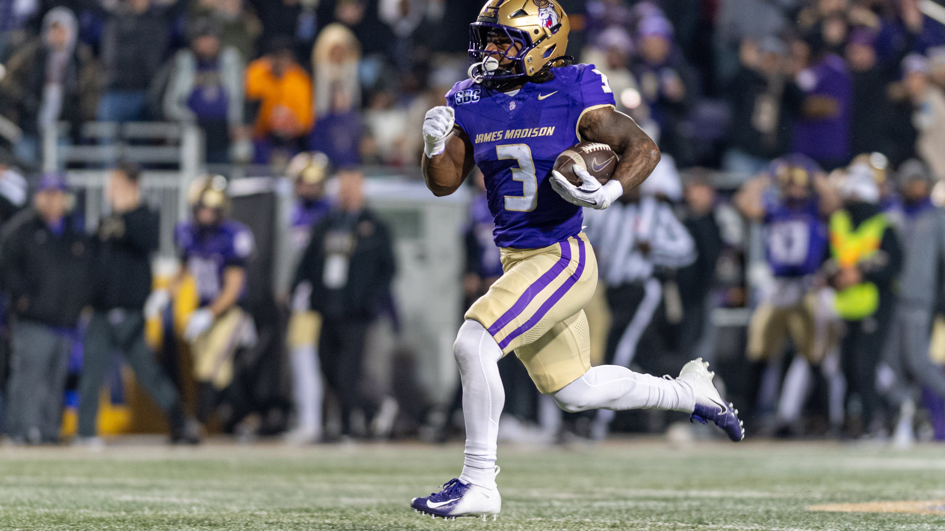 James Madison running back Wayne Knight (3) runs the ball for a touchdown against Troy during the first half of the Sun Belt Championship NCAA college football game, Friday, Dec. 5, 2025, in Harrisonburg, Va. (AP Photo/Robert Simmons)