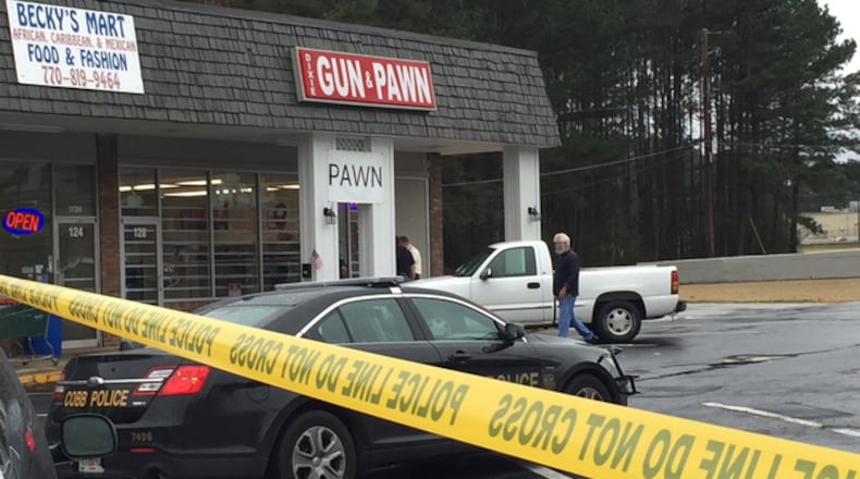 Two men attempted to rob Dixie Gun and Pawn on Dec. 26. A store employee shot one of the suspects, who died at the scene.