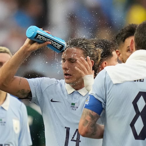Uruguay's Agustin Canobbio cools off during a hydration break in a World Cup Group H soccer match against Saudi Arabia in Miami Gardens, Fla., Monday, June 15, 2026. (AP Photo/Lynne Sladky)