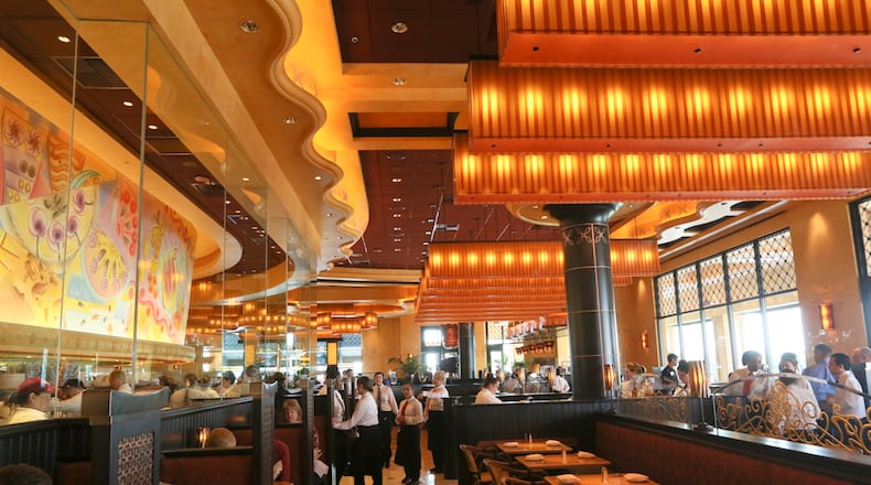 Cheesecake Factory employees work during a practice lunch session Saturday, Oct. 17, as they prepare for opening day at Liberty Center on Oct. 22. GREG LYNCH / STAFF
