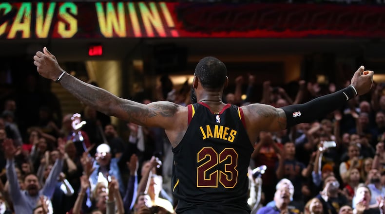 Look at me, world: LeBron James exults after a game-winning shot against Toronto during the Eastern Conference semifinals. (Gregory Shamus/Getty Images)