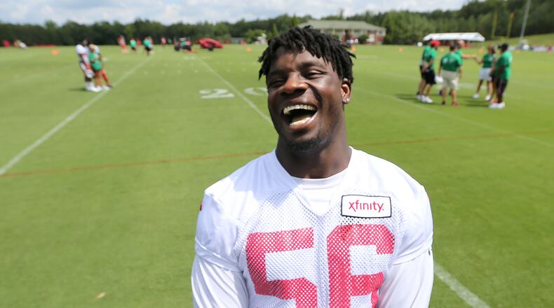 Falcons linebacker Sean Weatherspoon is all smiles as he lets go a laugh during training camp at the end of practice on Friday in Flowery Branch. (Curtis Compton/ccompton@ajc.com)