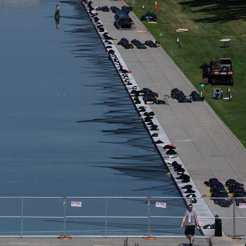 Workers install fireworks along the edge of the Lincoln Memorial Reflecting Pool ahead of the America 250 July 4th celebration on the National Mall, Thursday, July 2, 2026, in Washington. (AP Photo/Nathan Howard)