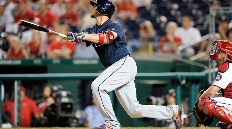 Tyler Flowers follows through on his game-winning three-run homer in the ninth inning of the Braves' 11-10 win over the Nationals Monday.