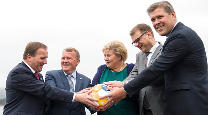 Nordic Prime Ministers, from left, Stefan Lofven of Sweden, Lars Lokke Rasmussen of Denmark, Erna Solberg of Norway, Juha Sipila of Finland and Bjarni Benediktsson of Iceland hold their hands on a soccer ball during a meeting in Bergen, Norway, Monday, May 29 2017. A Norwegian official say five Nordic prime ministers who posed for a photo clutching a soccer ball werenât intending to make fun of a viral image from U.S. President Donald Trumpâs trip to Saudi Arabia. (Marit Hommedal / NTB scanpix via AP)